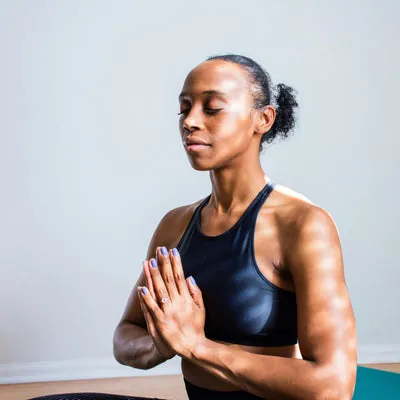 Woman meditating in a yoga pose