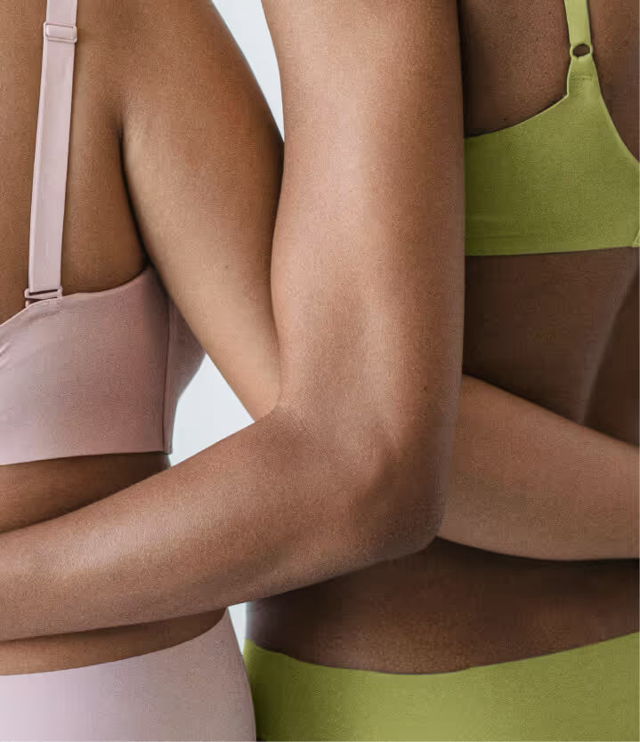 Two women standing showing weight loss
