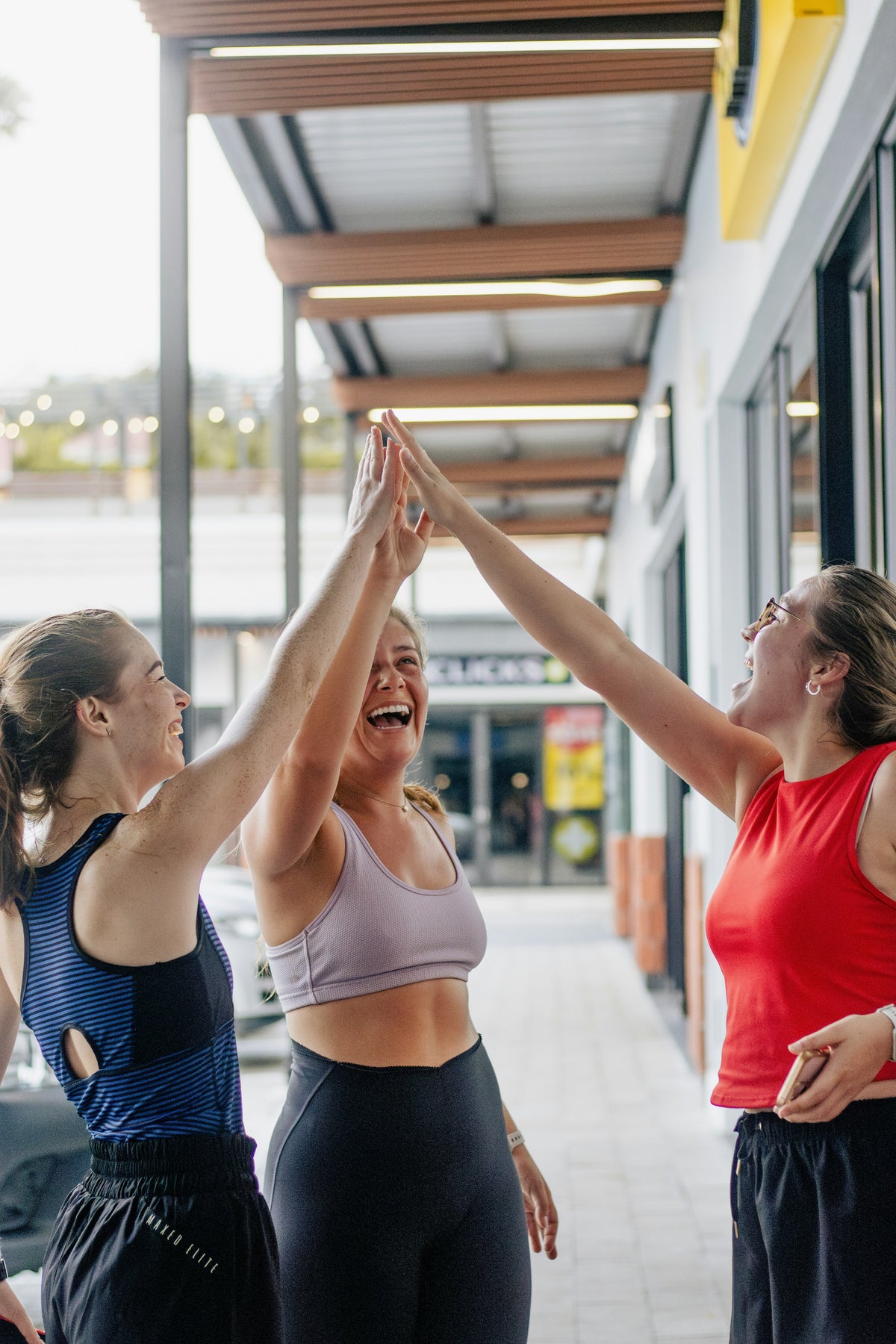 Two women standing showing weight loss